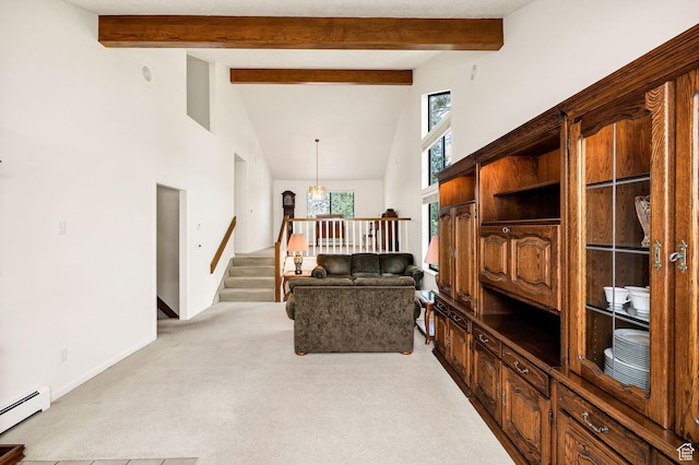 1729 N 1700 E, North Logan, UT 84341 - living room with a baseboard heating unit, high vaulted ceiling, light colored carpet, stairs, and a chandelier