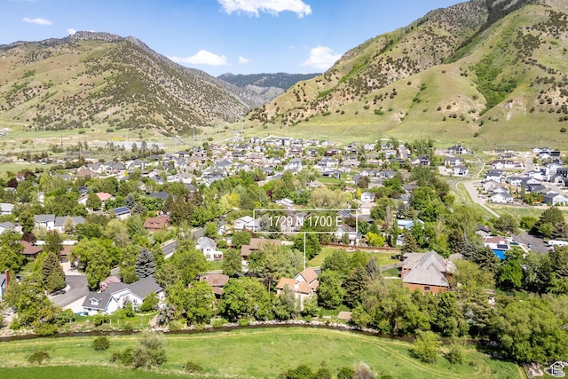 1729 N 1700 E, North Logan, UT 84341 - aerial view of property and surrounding area featuring nearby suburban area and mountains