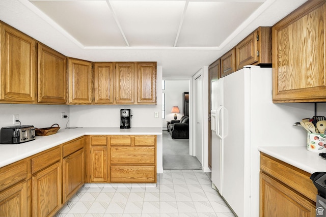 1729 N 1700 E, North Logan, UT 84341 - kitchen with light countertops, brown cabinetry, light floors, and white refrigerator with ice dispenser