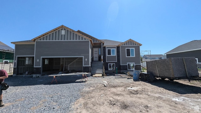 1856 S 2575 W, West Haven, UT 84401 - rear view of property featuring stairs, board and batten siding, and an attached garage