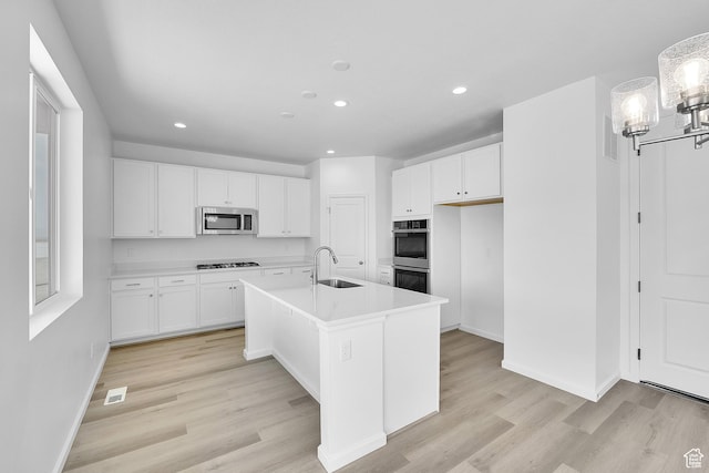 241 W 825 S Unit 305, Willard, UT 84340 - kitchen with appliances with stainless steel finishes, recessed lighting, a sink, white cabinets, and light wood-style floors