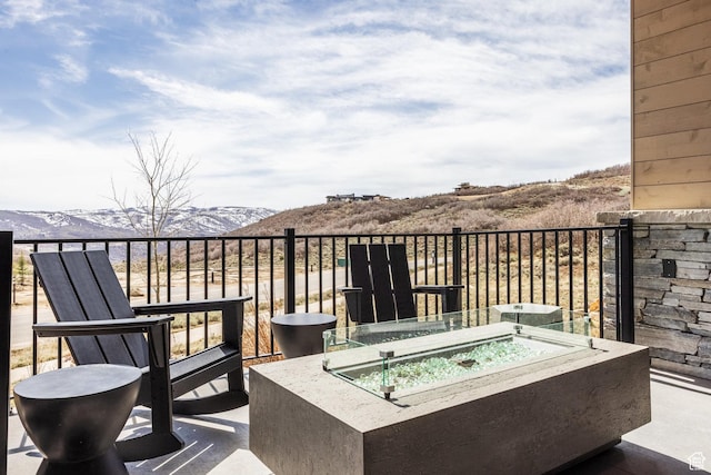 balcony featuring a fire pit and a mountain view