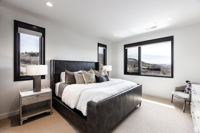 bedroom with light carpet, baseboards, and recessed lighting