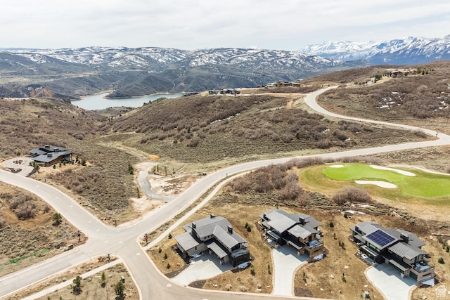 view of property location with a water and mountain view