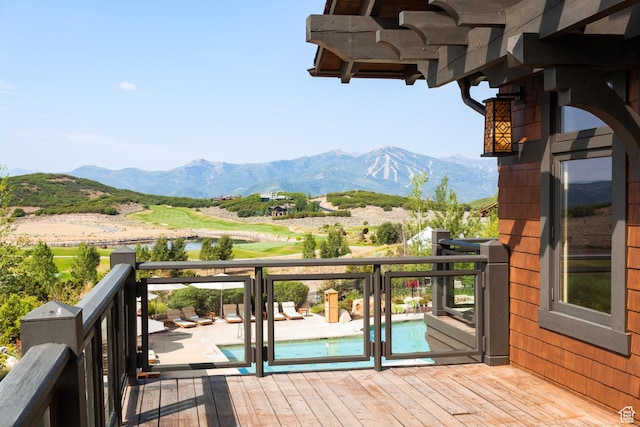 wooden terrace with a mountain view