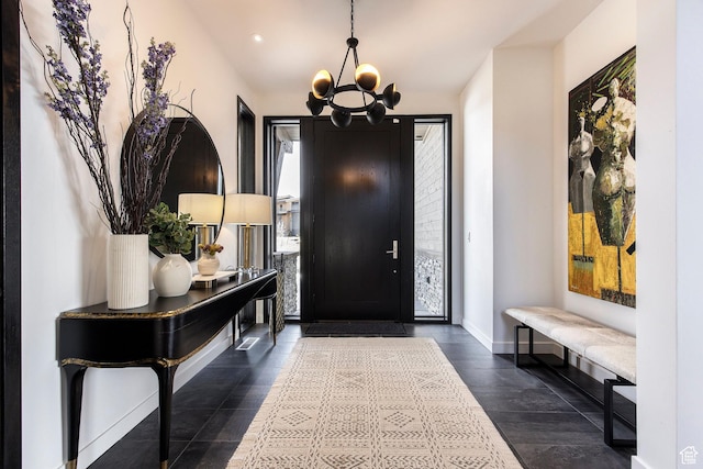 foyer with a chandelier, baseboards, and recessed lighting