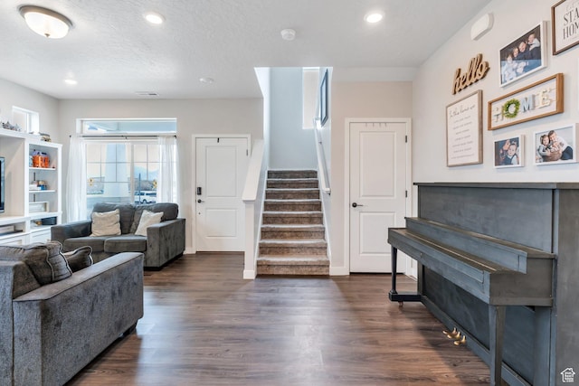 24 S Baker Spring Cv, Saratoga Springs, UT 84045 - living room featuring stairway, dark wood-style flooring, recessed lighting, and baseboards