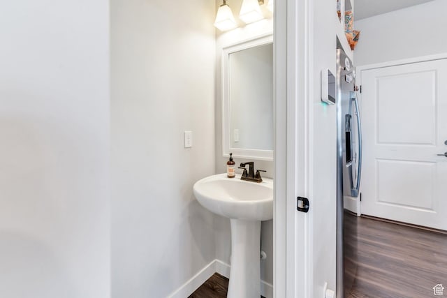 24 S Baker Spring Cv, Saratoga Springs, UT 84045 - bathroom with wood finished floors, a sink, and baseboards