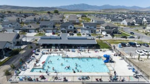 24 S Baker Spring Cv, Saratoga Springs, UT 84045 - drone / aerial view of a pool and mountains