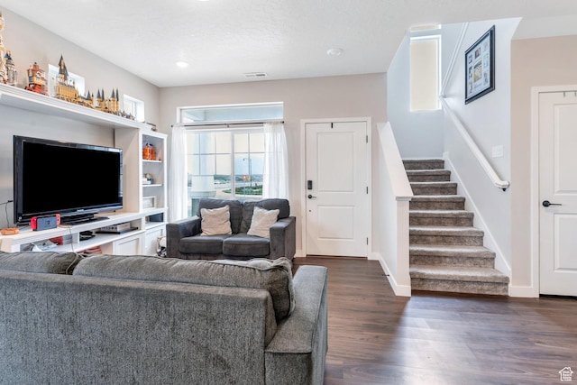 24 S Baker Spring Cv, Saratoga Springs, UT 84045 - living area with stairway, dark wood-style flooring, and baseboards