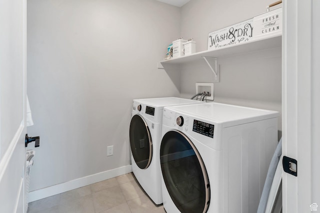 24 S Baker Spring Cv, Saratoga Springs, UT 84045 - laundry room with independent washer and dryer, baseboards, and light tile patterned floors