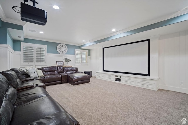 carpeted home theater with crown molding, a decorative wall, a wainscoted wall, and recessed lighting