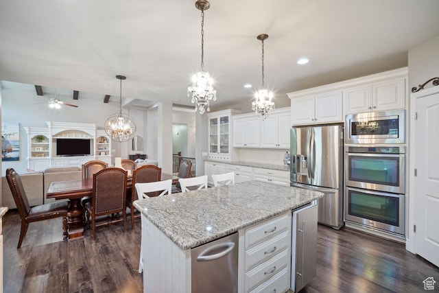 kitchen with appliances with stainless steel finishes, a chandelier, dark wood-style flooring, white cabinetry, and recessed lighting