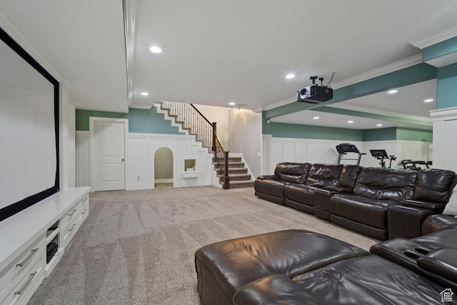 home theater room with a decorative wall, ornamental molding, wainscoting, carpet flooring, and recessed lighting