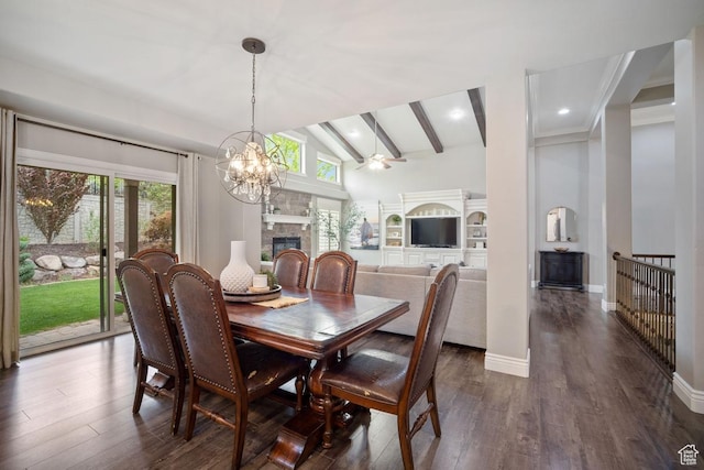dining space featuring a fireplace, plenty of natural light, a chandelier, dark wood finished floors, and recessed lighting