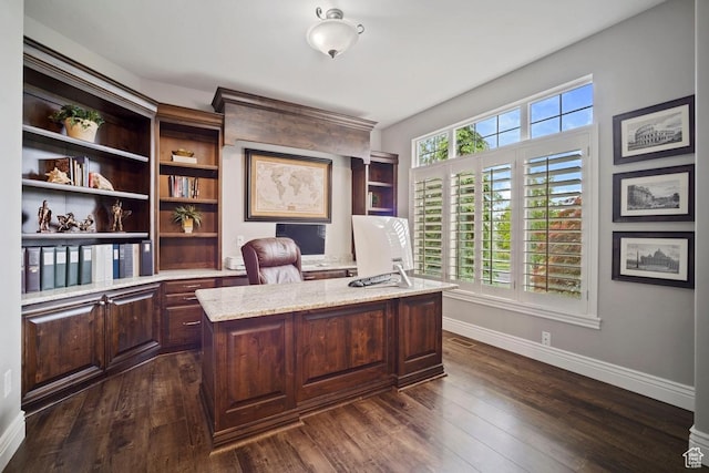 office space with baseboards and dark wood-style floors