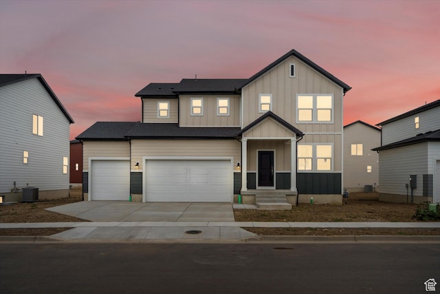 3457 S 3100 W Unit 174, West Haven, UT 84401 - view of front of house with board and batten siding, driveway, and a garage
