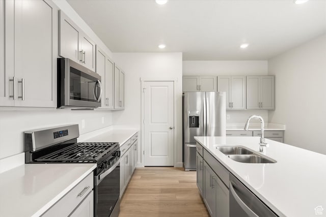 3457 S 3100 W Unit 174, West Haven, UT 84401 - kitchen with stainless steel appliances, recessed lighting, light wood-type flooring, light countertops, and gray cabinetry