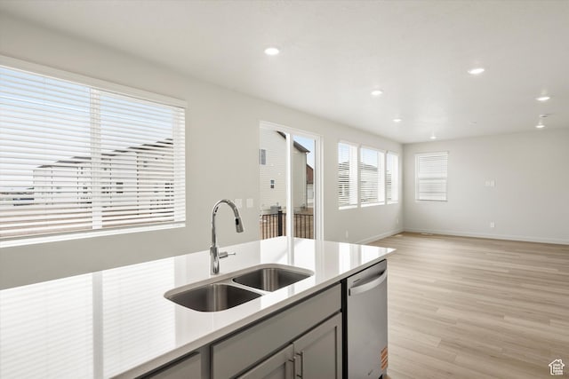 3457 S 3100 W Unit 174, West Haven, UT 84401 - kitchen with stainless steel dishwasher, light countertops, light wood finished floors, gray cabinetry, and recessed lighting