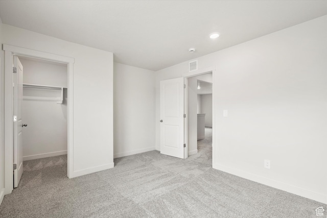 3457 S 3100 W Unit 174, West Haven, UT 84401 - unfurnished bedroom featuring carpet flooring, a walk in closet, recessed lighting, and a closet