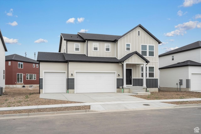 3457 S 3100 W Unit 174, West Haven, UT 84401 - view of front of property featuring board and batten siding, a garage, and driveway