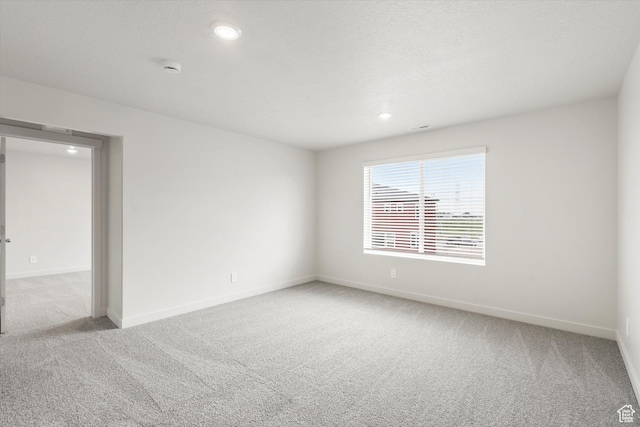 3457 S 3100 W Unit 174, West Haven, UT 84401 - empty room with light colored carpet, recessed lighting, and a smoke detector