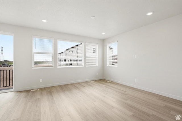 3457 S 3100 W Unit 174, West Haven, UT 84401 - empty room featuring plenty of natural light, light wood-style floors, and recessed lighting