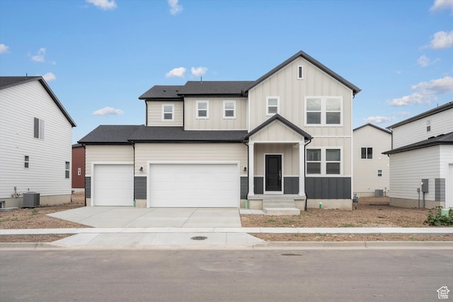3457 S 3100 W Unit 174, West Haven, UT 84401 - view of front of home with board and batten siding, driveway, and a garage