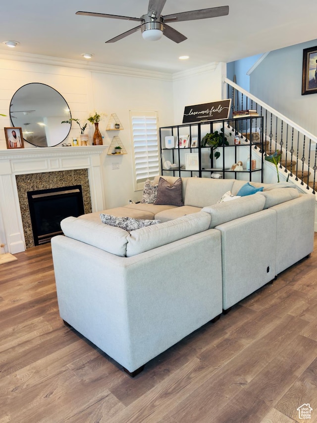 4382 N Pheasant Ridge Trl, Lehi, UT 84043 - living area featuring ceiling fan, ornamental molding, stairway, wood finished floors, and a premium fireplace