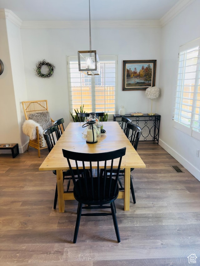 4382 N Pheasant Ridge Trl, Lehi, UT 84043 - dining room featuring ornamental molding, baseboards, wood finished floors, and a chandelier