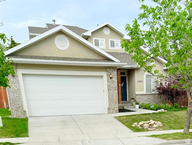 4382 N Pheasant Ridge Trl, Lehi, UT 84043 - traditional home featuring stucco siding, concrete driveway, roof with shingles, and brick siding