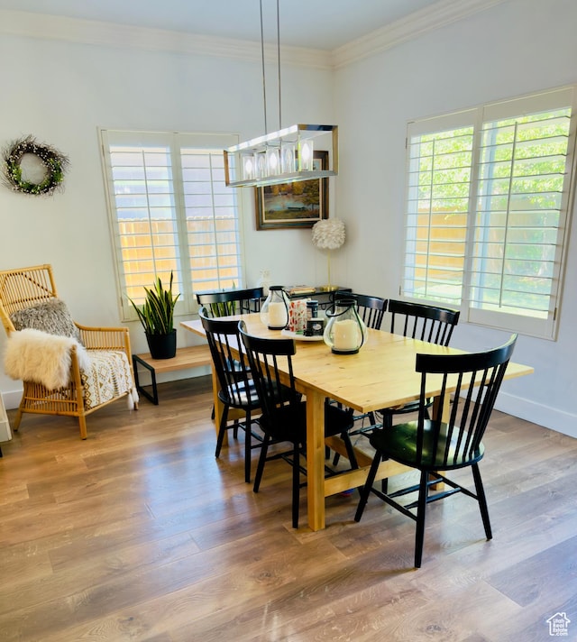 4382 N Pheasant Ridge Trl, Lehi, UT 84043 - dining area with plenty of natural light, crown molding, wood finished floors, and baseboards