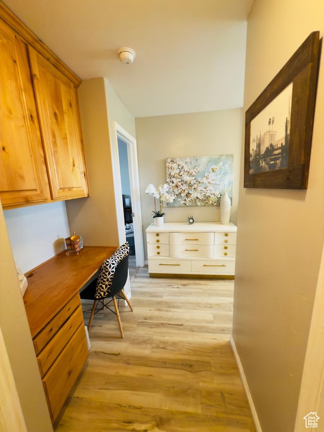 4382 N Pheasant Ridge Trl, Lehi, UT 84043 - hallway with light wood finished floors and a desk