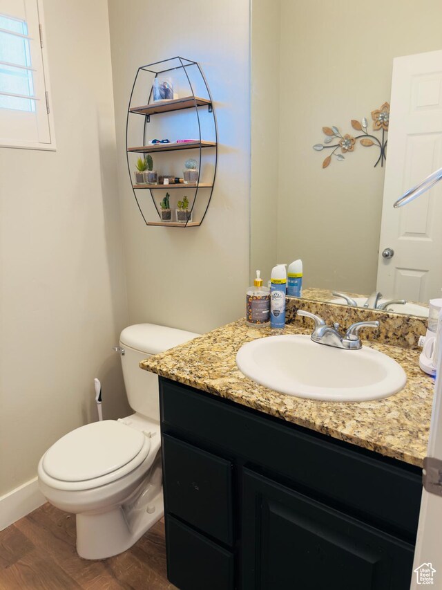 4382 N Pheasant Ridge Trl, Lehi, UT 84043 - bathroom featuring wood finished floors, vanity, toilet, and baseboards