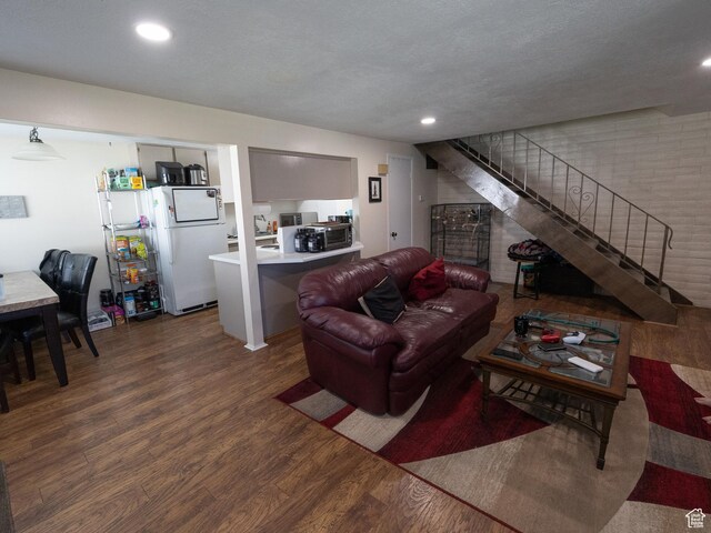 4318 S 1100 W Unit 34C, Salt Lake City, UT 84123 - living area featuring wood finished floors, stairs, and recessed lighting