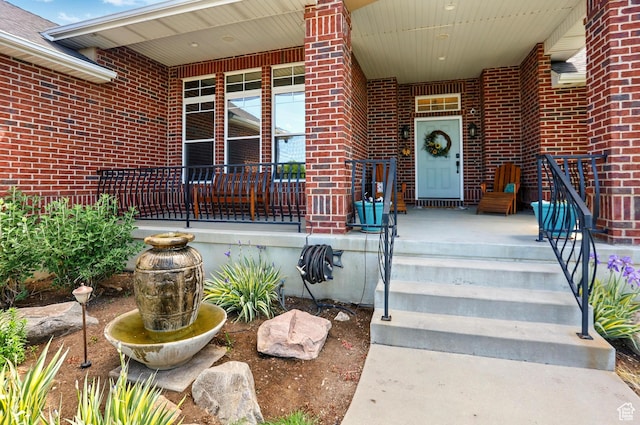 7639 S 475 W, Willard, UT 84340 - property entrance featuring brick siding and covered porch