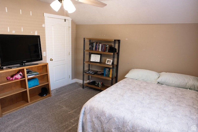 bedroom featuring carpet flooring, a ceiling fan, and vaulted ceiling