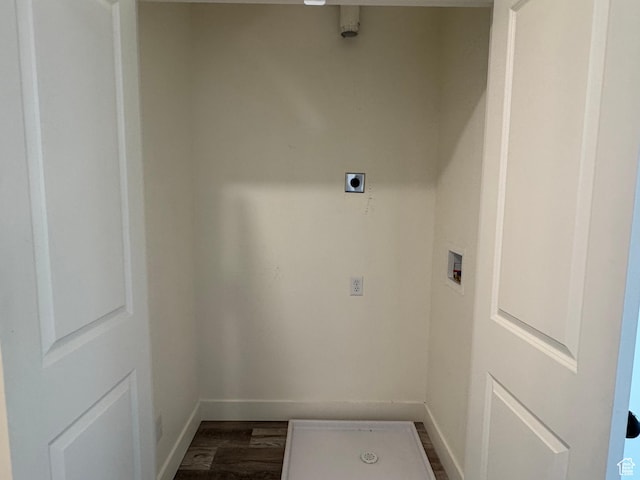 laundry room with baseboards, dark wood-type flooring, washer hookup, and electric dryer hookup