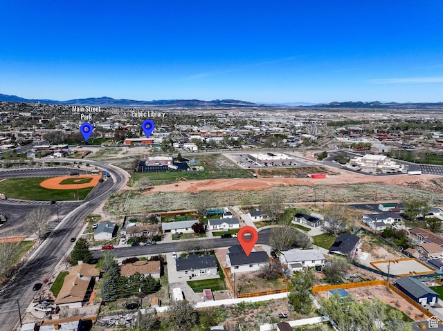 aerial overview of property's location featuring mountains and nearby suburban area