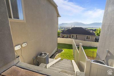 6966 N S Pass Rd, Eagle Mountain, UT 84005 - exterior space featuring stucco siding and a mountain view