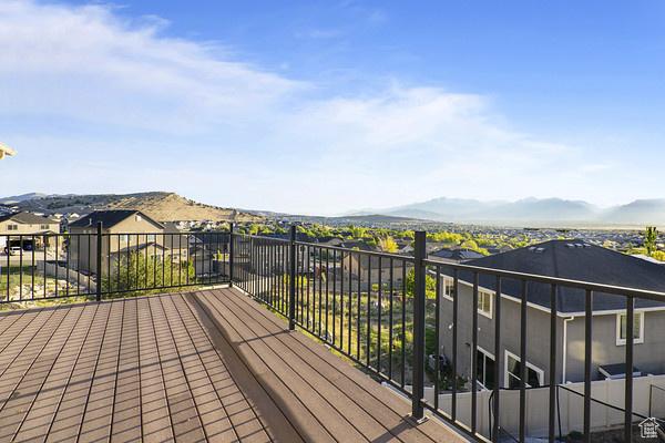 6966 N S Pass Rd, Eagle Mountain, UT 84005 - wooden deck featuring a mountain view
