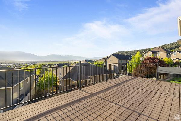 6966 N S Pass Rd, Eagle Mountain, UT 84005 - wooden terrace with a residential view and a mountain view