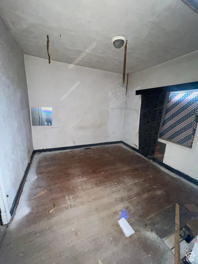 963 W 400 N, Salt Lake City, UT 84116 - unfurnished living room with baseboards and wood finished floors