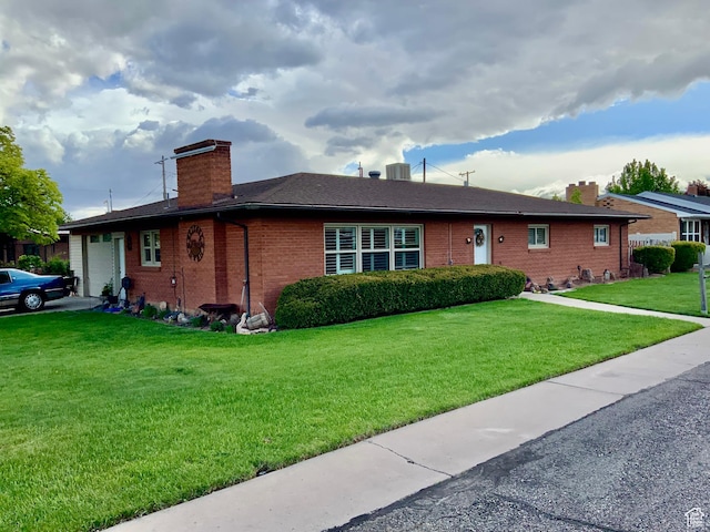 111 W 570 N, Richfield, UT 84701 - ranch-style home with a chimney, a garage, brick siding, a front yard, and cooling unit