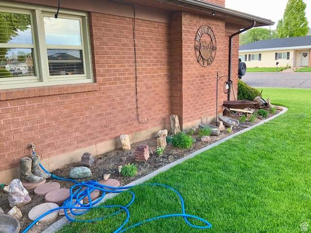 111 W 570 N, Richfield, UT 84701 - view of side of property featuring brick siding and a yard