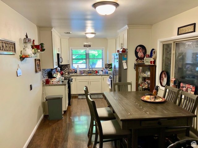 111 W 570 N, Richfield, UT 84701 - dining space with dark wood-type flooring and baseboards