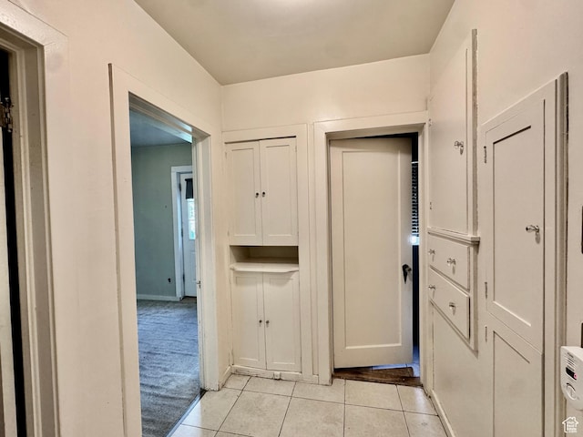 hallway with light tile patterned floors