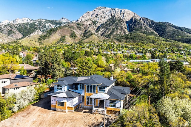 view of mountain backdrop featuring nearby suburban area