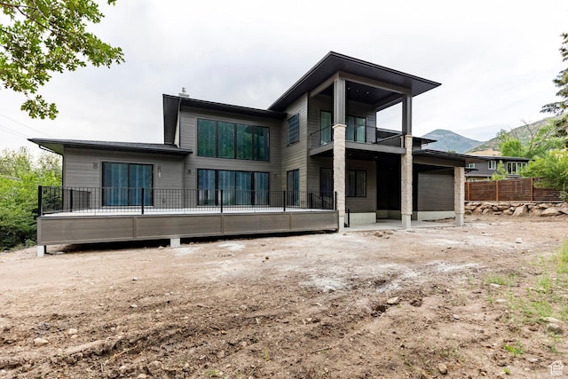 3756 E Hermes Dr, Salt Lake City, UT 84124 - rear view of house with a balcony and a mountain view