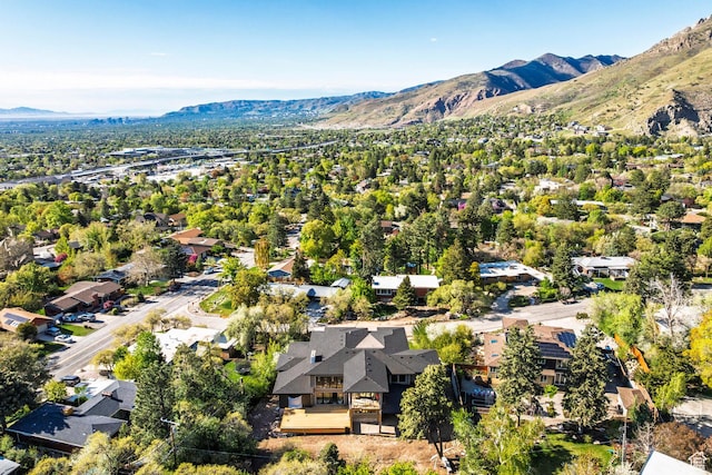 aerial view of residential area featuring a mountainous background